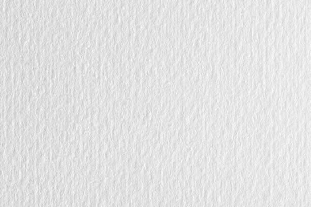 istock Clean light white lined paper texture on macro. High resolution photo. 1165673312