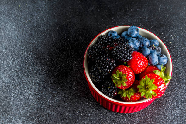 istock Fresh berries in a small bowl 1165674147