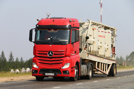 Novyy Urengoy, Russia - July 20, 2019: Natural gas well's service truck Mercedes-Benz Actros at the interurban road.