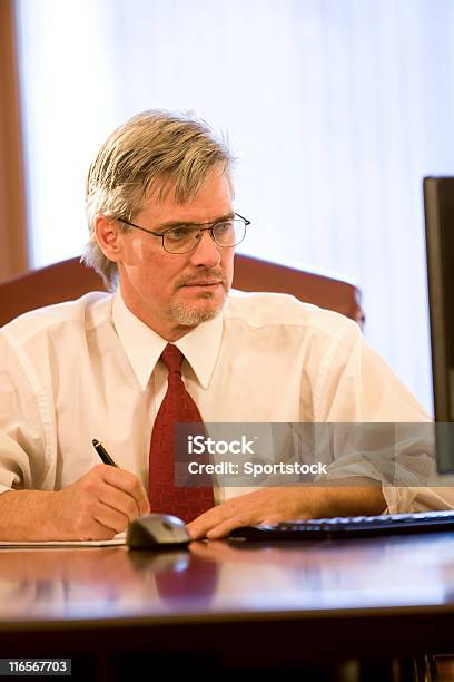 Businessman Looking At Computer Stock Photo - Download Image Now - 40-49 Years, Alertness, Assistance