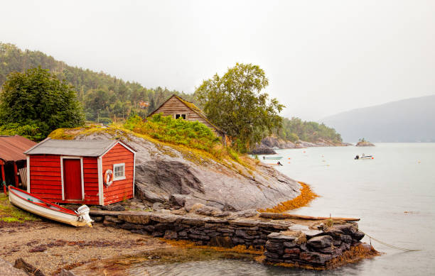 istock Bridge with red boathouse by Hardanger fiord in Norway 1165677840
