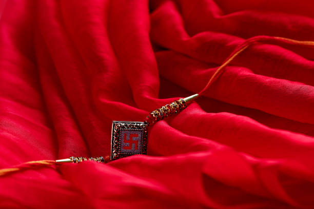 istock Raksha bandhan,rakhi with on red background 1165677888