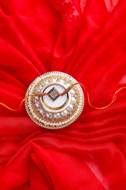 istock Raksha bandhan,rakhi with on red background 1165677929