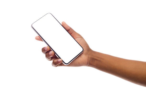 negro mano hembra sosteniendo frameless smartphone con pantalla vacía - manos fotografías e imágenes de stock