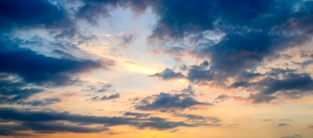 istock Cloudy sky and bright sun rise over the horizon. 1165680186
