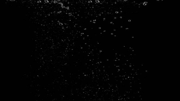 istock Water bubbles floating after splash underwater and black background which represent freshness of carbonate drink such as cola or soda and refreshing feeling of food product and texture. 1165681291