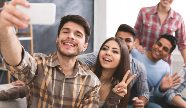 istock Selfie time. Multicultural friends making group photograph 1165681763