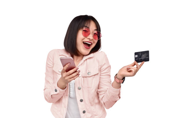 istock Cheerful ethnic lady using online banking service 1165682520