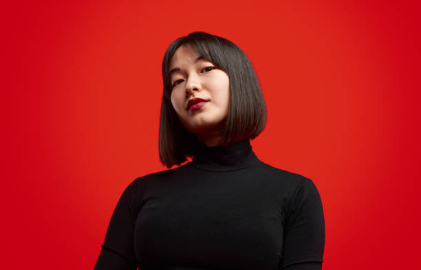 istock Stylish Asian female looking at camera 1165682523