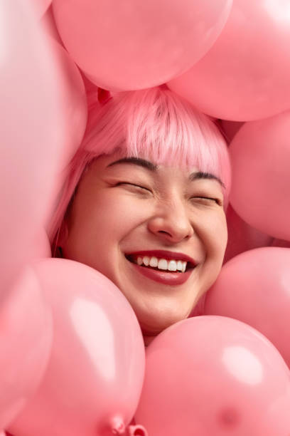 istock Excited ethnic lady amidst balloons 1165682558