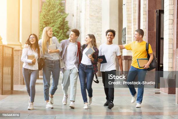 Happy Students Walking Together In Campus Having Break Stock Photo - Download Image Now