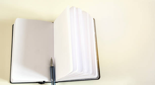 istock A ballpoint pen in the middle of an open notebook 1165686117