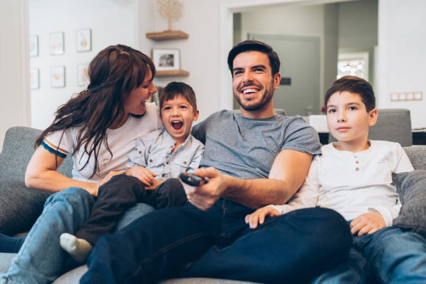 istock Family watching television 1165688558