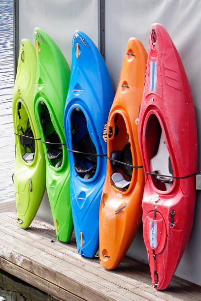 istock Colored Kayaks for rental at lake 2/2 1165690085