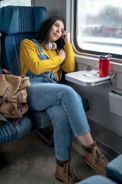 istock Young woman traveling by train 1165692038