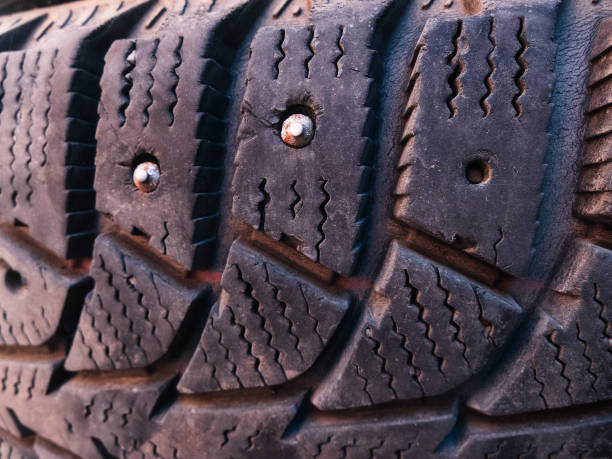 istock Close-up of winter studded car tyre protector 1165694470