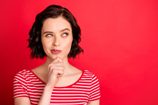 Photo of thoughtful lady thinking over her plan about running away from home while isolated with red background