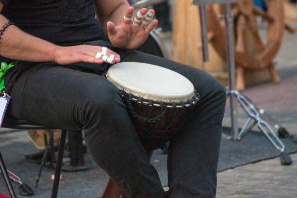 istock ethnic percussion musical instrument jembe and male hands 1165695094