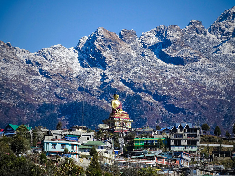 Gaint buddha statue of tawang surrounded by mighty Himalayan Mountains