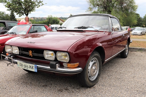 Peugeot 504 Coupe Red Convertible Car of 1971 - 3 rd Meeting of Old Vehicles in Saint Agnin sur Bion Isère - July 28, 2019 - front of the car