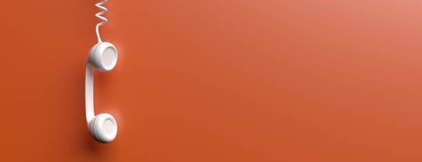 istock Old phone receiver on orange color background. 3d illustration 1165696824
