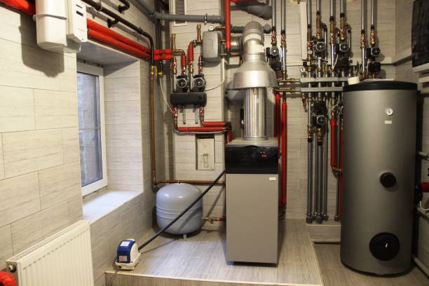 House boiler, water heater, expansion tank and other pipes. newmodern independent heating system in boiler room House boiler, water heater, expansion tank and other pipes. newmodern independent heating system in boiler room, gas boiler photos stock pictures, royalty-free photos & images