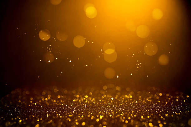 istock Golden abstract bokeh on black background. 1165700669