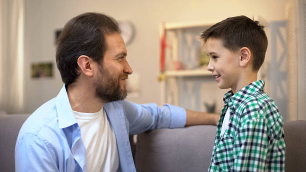 istock Father sharing life experience with his son, giving advices, family relations 1165701151