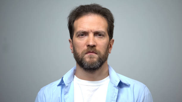 istock Sad middle-aged man looking into camera, unemployment, social insecurity 1165701431