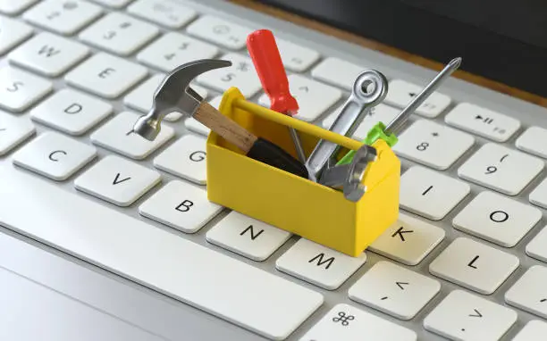 tools on the keyboard of a latop, 3d rendering,conceptual image. service  and support concepts.