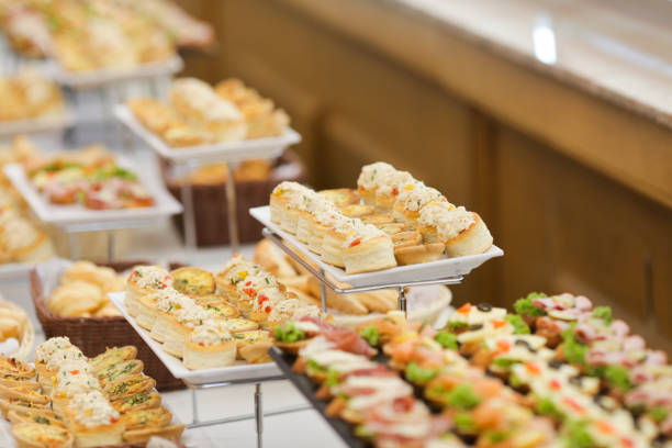 istock Shallow depth of field image with appetizers on a table at an event, provided by a catering company 1165702712