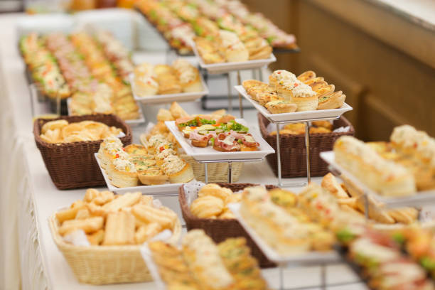 istock Shallow depth of field image with appetizers on a table at an event, provided by a catering company 1165702761