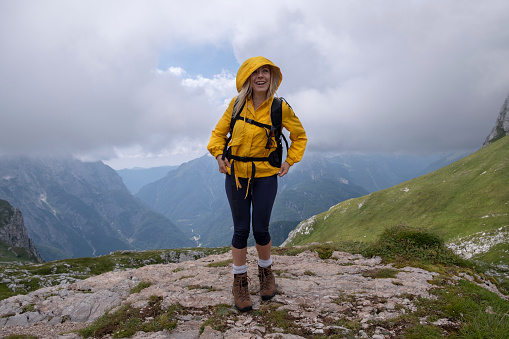 Woman Looking At The View Of Mountain Mangart In Slovenian Alps