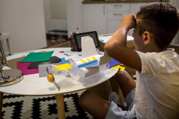 istock Learning on internet how to make recycled toys 1165704258