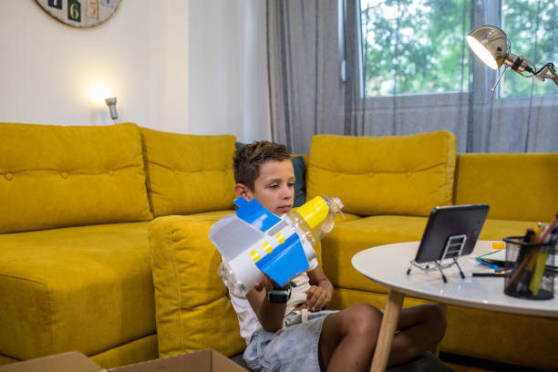 istock Young boy is playing with his DIY toy 1165704822