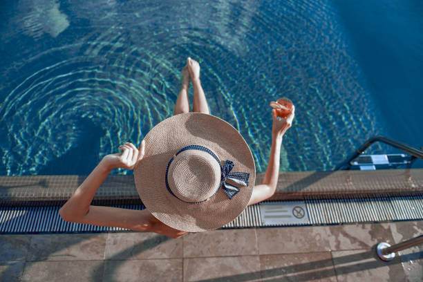istock Caucasian woman having rest in swimming pool 1165705591