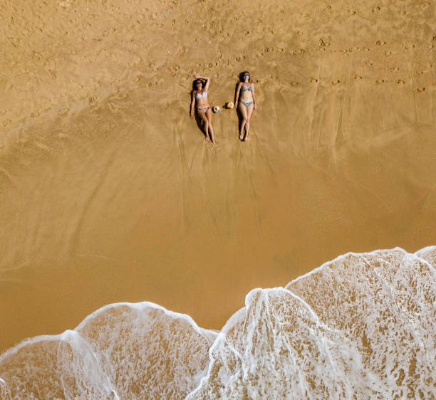 istock Young girls on a sandy beach in Vietnam 1165706639