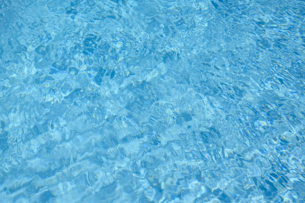 istock Beautiful ripple wave and blue water surface in swimming pool 1165707567