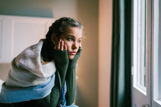 depressed girl at home - depression women sadness window imagens e fotografias de stock