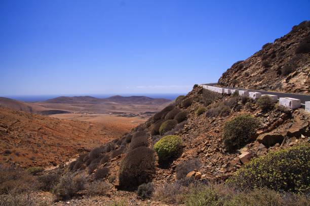 istock View on serpentines of steep mountain road 1165709758