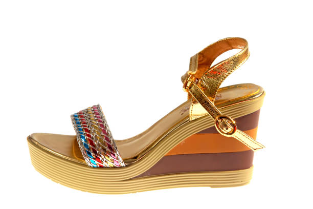 istock beautiful Women's high-heeled color sandals on a white background 1165711471
