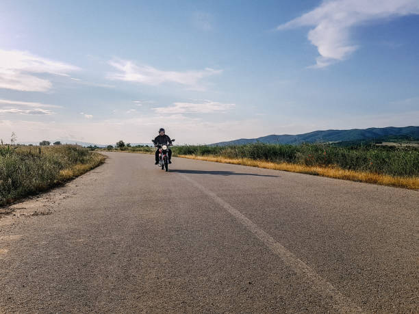 istock Man driving on his motorcycle on highway 1165711622