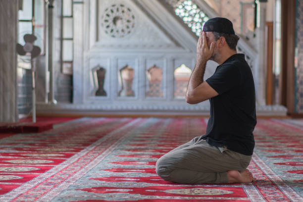 istock Muslim mature men prayer in mosque 1165714643