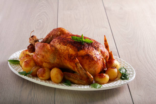 istock Roast whole chicken with potatoes 1165715090