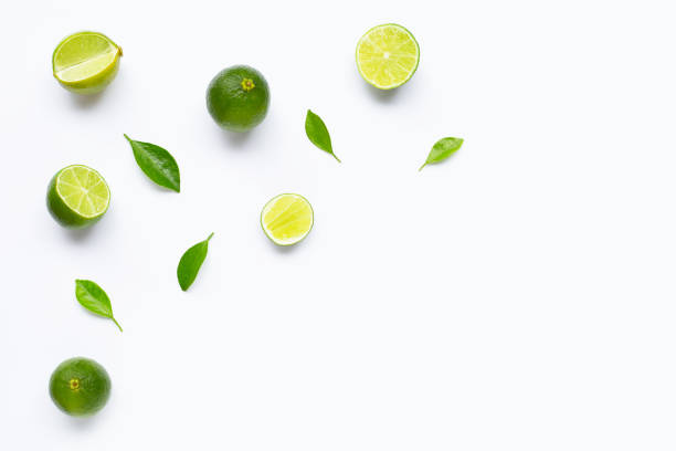 istock Limes with leaves isolated on white background. 1165716246