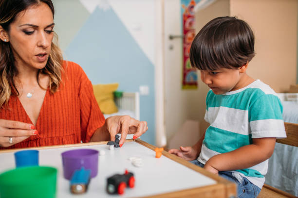 istock Mother and Son Playing with Child's Play Clay 1165717490