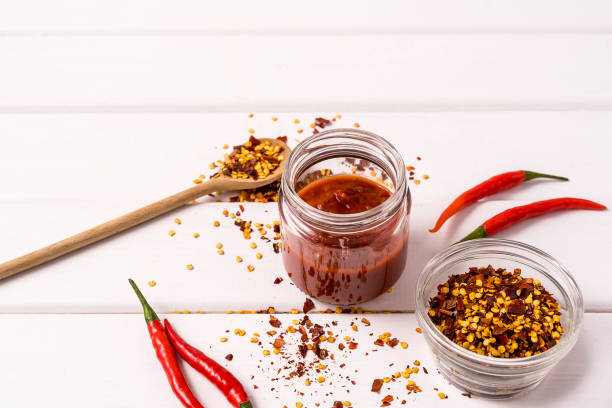 istock Homemade red Harissa Paste, chili pepper spices and fresh red chilli peppers. 1165718447