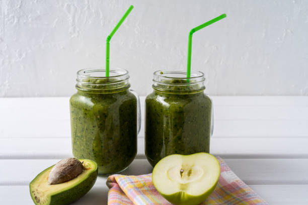 istock Vegetable and fruit homemade Smoothie With Spinach, apple, celery, kiwi, Brussels sprout, avocado. 1165718449