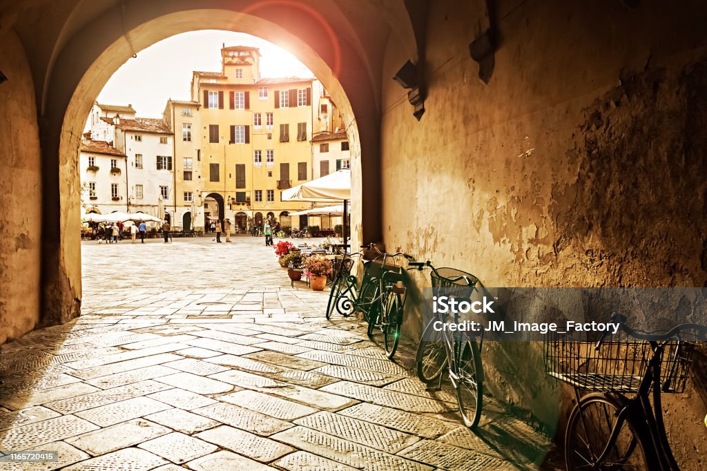 Sunset in Lucca, Italy The Square of the Amphitheatre in Lucca, Itlay at Sunset Italy Stock Photo