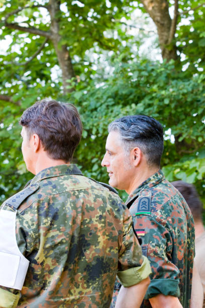 istock Two military officers observe a military exercise 1165721403